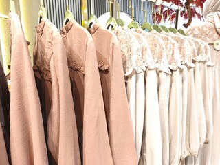 A collection of Muslim clothing for women with various designs, patterns and colors is sold in a clothing shop.