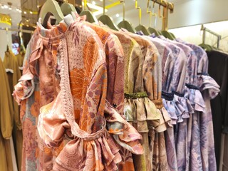 A collection of Muslim clothing for women with various designs, patterns and colors is sold in a clothing shop.