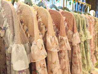 A collection of Muslim clothing for women with various designs, patterns and colors is sold in a clothing shop.