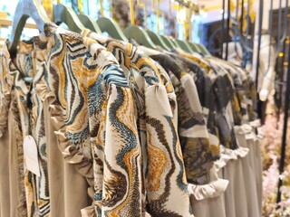 A collection of Muslim clothing for women with various designs, patterns and colors is sold in a clothing shop.