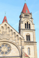 Obraz premium An ancient Christian church with a red roof. An ancient church with towers