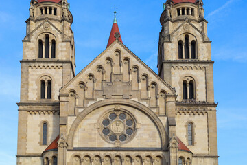 Fototapeta premium An ancient Christian church with a red roof. An ancient church with towers