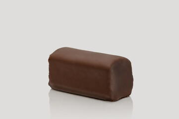 Cottage cheese bar in chocolate glaze. On a gray background. Sweet dessert.