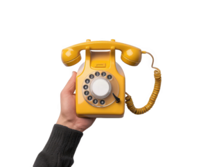 A hand holding a bright yellow vintage rotary dial telephone, isolated on transparent background, evoking nostalgia and communication from a bygone era