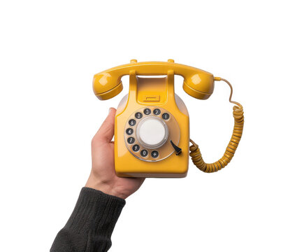 A hand holding a bright yellow vintage rotary dial telephone, isolated on transparent background, evoking nostalgia and communication from a bygone era