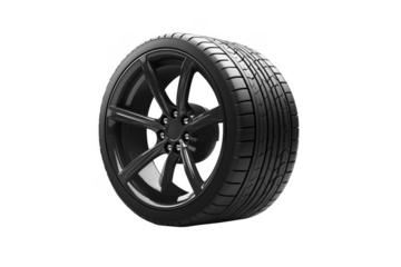 Glossy black alloy wheel and tire isolated against a transparent background for automotive design