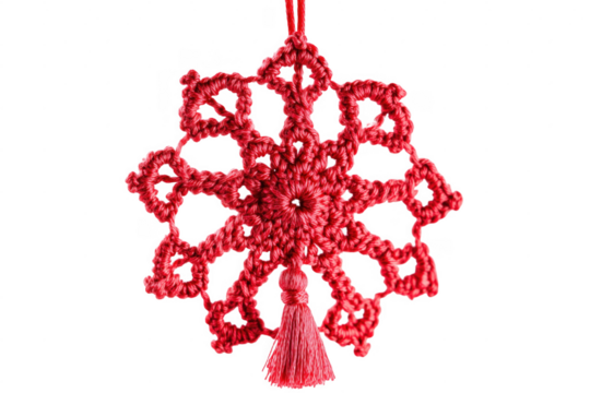 Handmade red crochet snowflake ornament with tassel against a dark transparent background