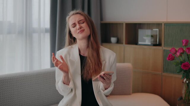 Frustrated woman female girl with smartphone scam message bet loss error, bills or ecommerce, expressing anger and disgust as she reacts to a negative message or offensive content on her smartphone