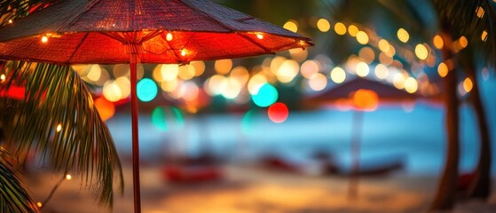 Lighted beach umbrella at night summer vacation tropical relaxation