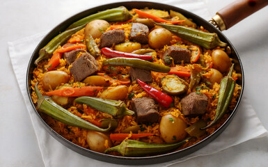 Turli tawa is a dish made from potatoes, rice, okra, eggplant, carrots, peppers and meat (pork, beef or lamb).