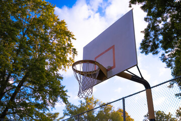 basketball hoop on blue sky background