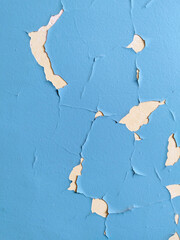 Old texture. residential building. Cracked blue paint on wall. Peeling off painted background. House repair. Housing service. Plaster. Damaged. terrible condition. Poverty concept. Textured effect.
