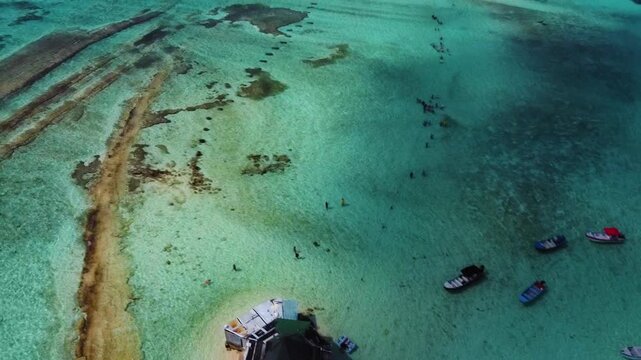 Acuario in San Andres Island, Colombia. Showing a bar in the middle of a turquoise sea. Taken with my drone
