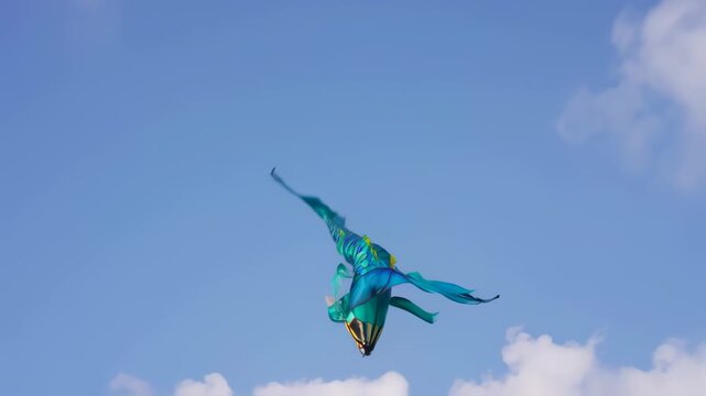 Colorful mermaid kite in a clear blue sky