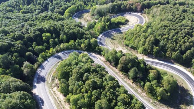 Aerial view of winding asphalt mountain road among green trees in summer. (Domani&ccedil;,İneg&ouml;l dağ yolu)	