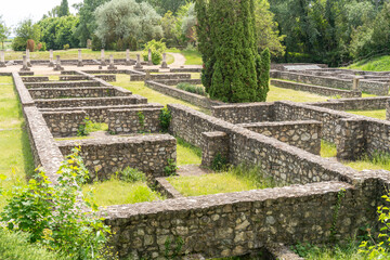 Ruins of old stone buildings on the site of an ancient Roman city