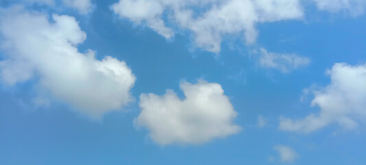 Obraz premium White Fluffy Clouds in a Blue Sky