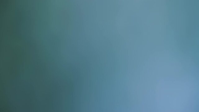 Blurred, muted teal-gray gradient