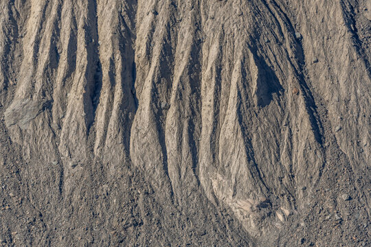Land that shows natural streaks and forms created by erosion in arid landscape