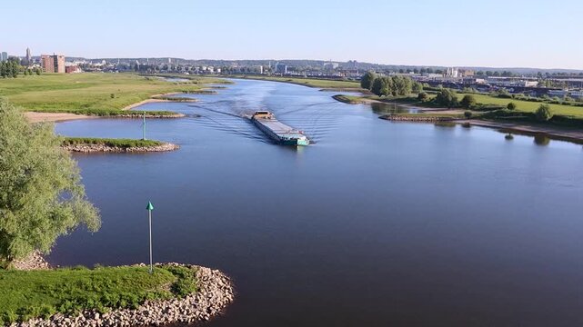 Large cargo ship on the river Rhine near Arnhem in the Netherlands in summer