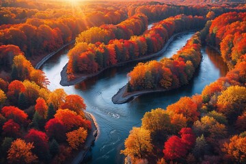 Autumn colors glow over winding river in a forest landscape