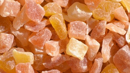 Full frame of dried sweetened diced papaya.