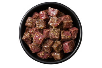 Overhead view of delicious marinated and seasoned beef cubes served in a transparent background