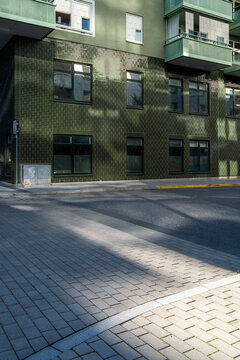 Urban street corner in Stockholm with shadow and minimalist fa&ccedil;ade, Scandinavian architecture providing copy space and clean background for graphic layouts, posters and visual communication