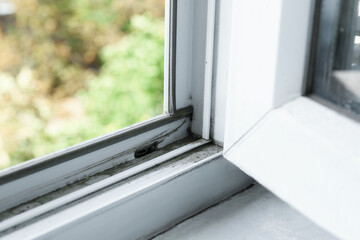 Window frame covered with dust indoors, closeup