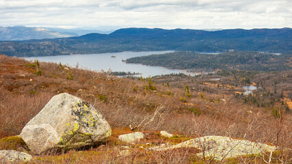 Timeless landscape of Norway’s highlands stretches toward the horizon, where Nordic mountains meet the still waters of Scandinavia’s northern lakes.