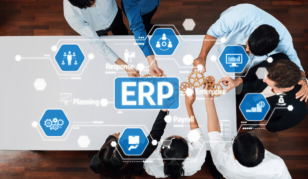 A diverse team collaborates on an ERP implementation strategy, surrounded by digital interfaces depicting essential management processes and tools for business efficiency. Amity