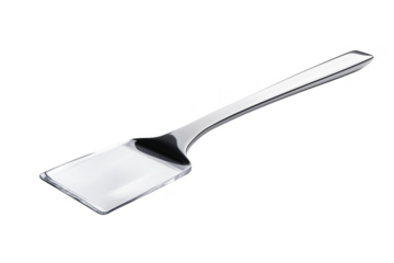 Shiny silver metal cake server isolated against a dramatic transparent background for editorial use