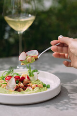 Woman enjoying fresh healthy food and white wine