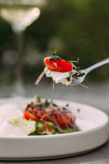 Taking a bite of fresh healthy salad ingredients © Iryna
