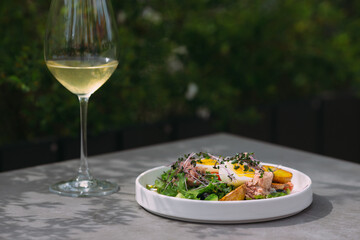 Fresh caesar salad with tuna and eggs