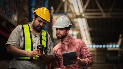 Warehouse workers and manager in reflective vests inspecting inventory, using digital tablet for stock control, logistics, supply chain management, and modern industrial warehouse operations.
