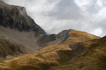 Scenic high mountain slope on the Tour du Mont Blanc route in the Italian Alps, perfect for travel, tourism, and nature themes.