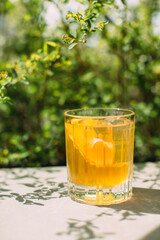 Refreshing summer drink with orange and ice