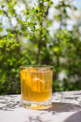 Refreshing summer cocktail with citrus and ice outside