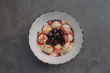Hungarian cottage cheese dumplings with sour cherry sauce
