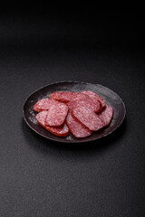 Sliced salami sausage, smoked meat as a delicacy for the table. Salami sausage