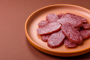 Sliced salami sausage, smoked meat as a delicacy for the table. Salami sausage