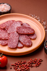 Sliced salami sausage, smoked meat as a delicacy for the table. Salami sausage