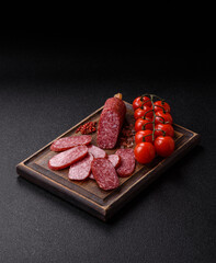 Sliced salami sausage, smoked meat as a delicacy for the table. Salami sausage