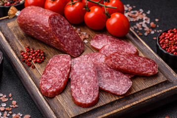 Sliced salami sausage, smoked meat as a delicacy for the table. Salami sausage