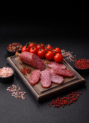 Sliced salami sausage, smoked meat as a delicacy for the table. Salami sausage