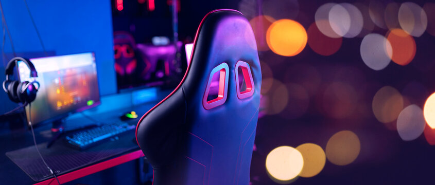 Gaming setup with vibrant lighting, banner esports environment - Powered by Adobe