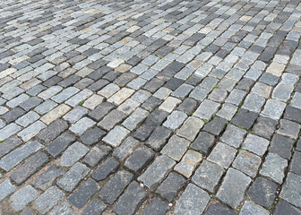 Abstract background. Old cobblestone pavement closeup