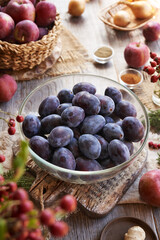 Fresh whole plums, apples, ginger, onion and spices - ingredients for chutney - homemade relish