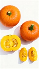 Four pumpkins on white background, some whole and some cut open.